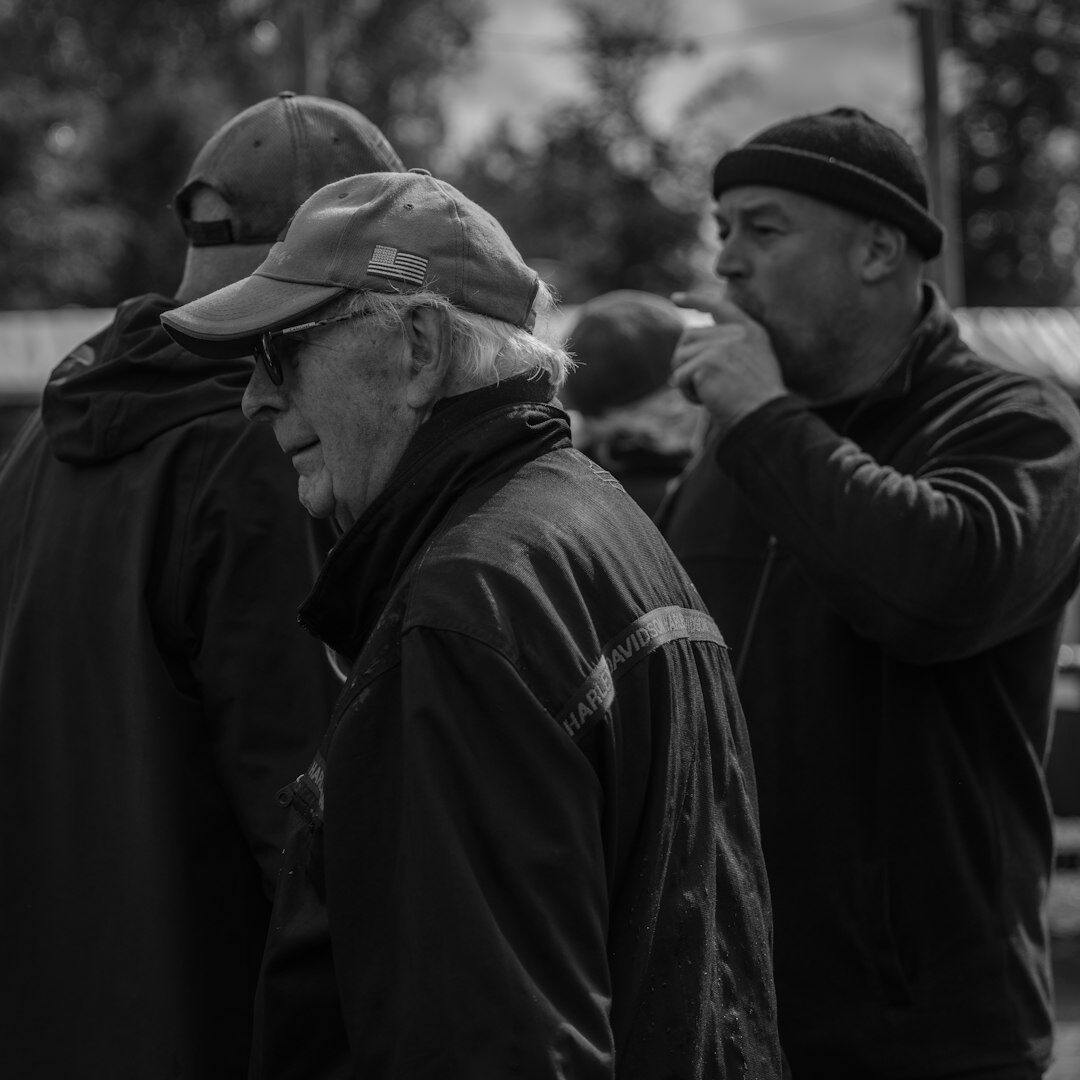 Team of documentary photographers and journalists standing together outdoors